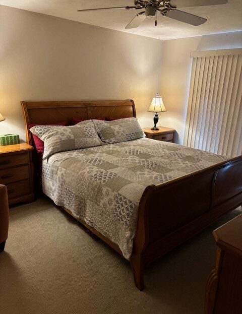 Cozy bedroom with wooden furniture and soft lighting.