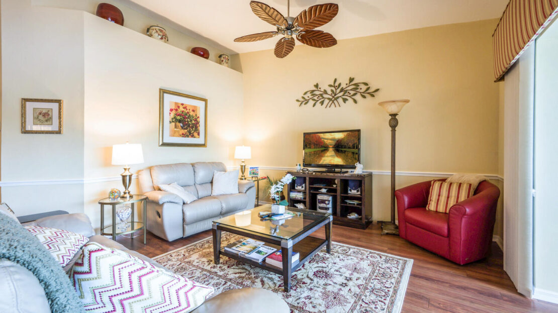 Cozy living room with comfortable seating and warm lighting.