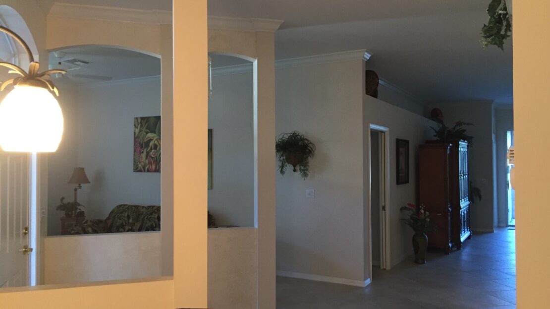 Cozy indoor space with warm lighting and wall decor.