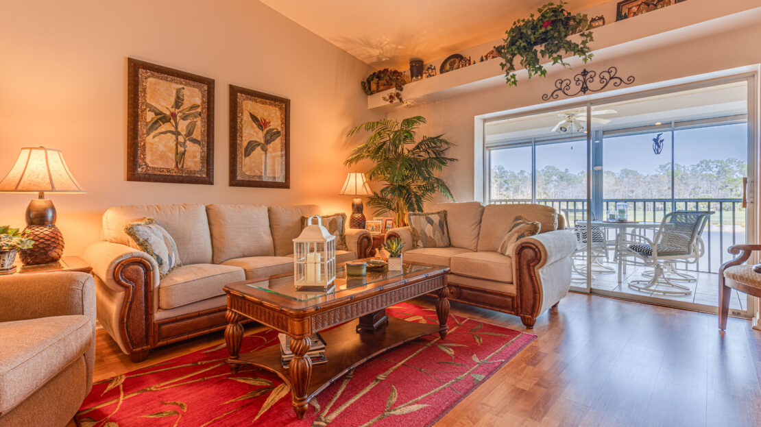 Cozy living room with elegant furniture and warm lighting.