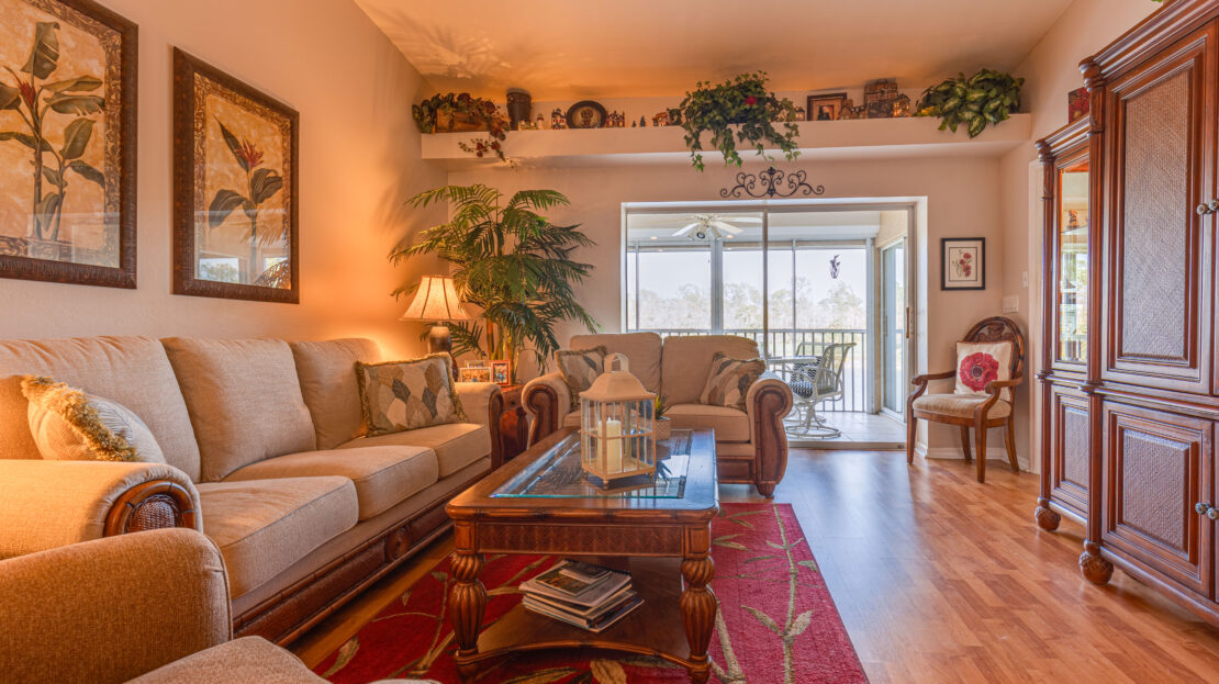 Cozy living room with warm lighting and comfortable seating.