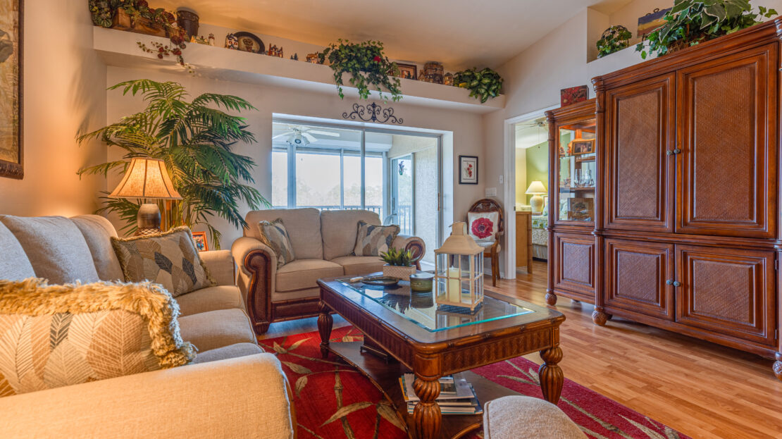 Cozy living room with classic furniture and warm lighting.