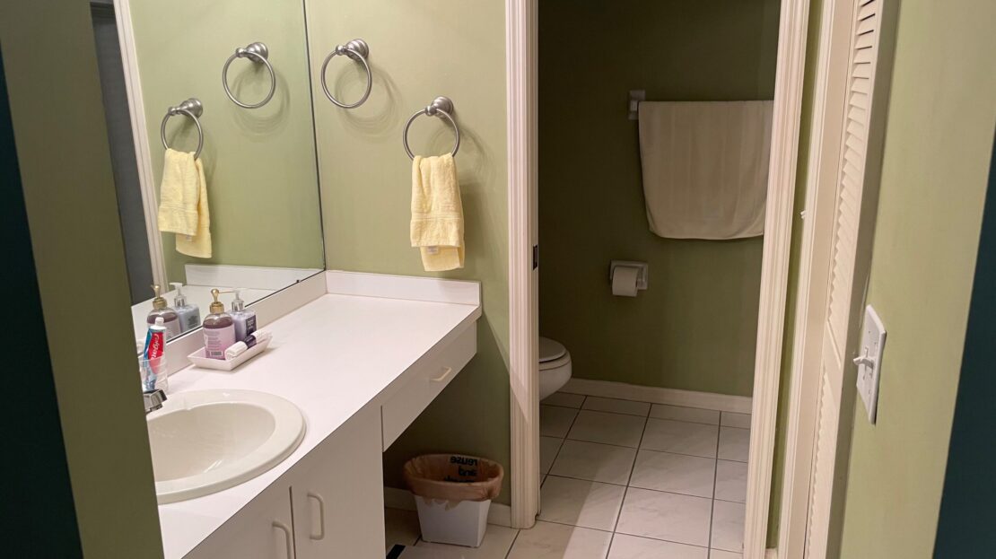 Clean bathroom with a double sink and a separate shower area.