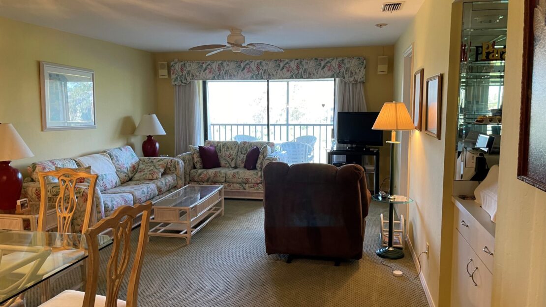 Cozy living room with comfortable seating and natural light.