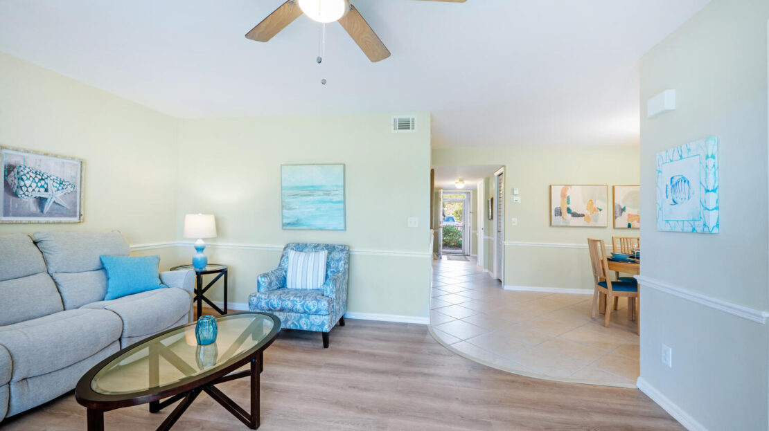 Bright living room with a ceiling fan and modern decor.