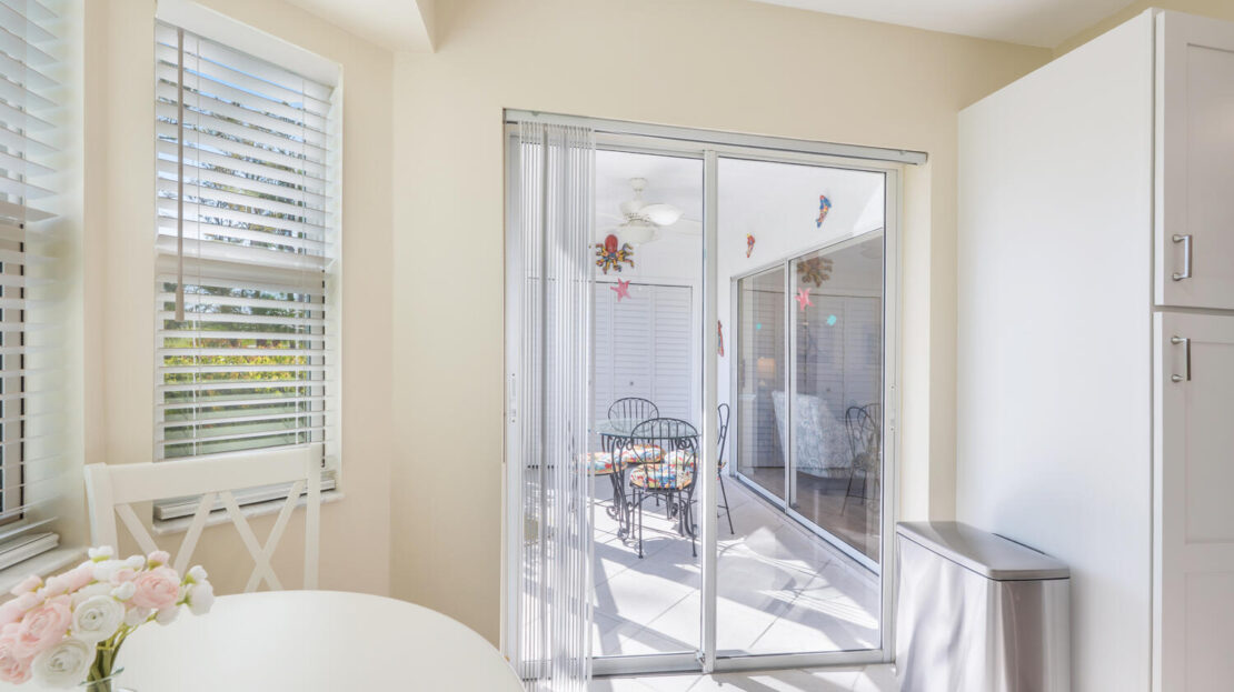 Bright dining area with sliding glass doors to an outdoor patio.