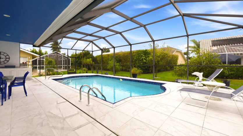 Bright indoor pool area with clear water and garden views.