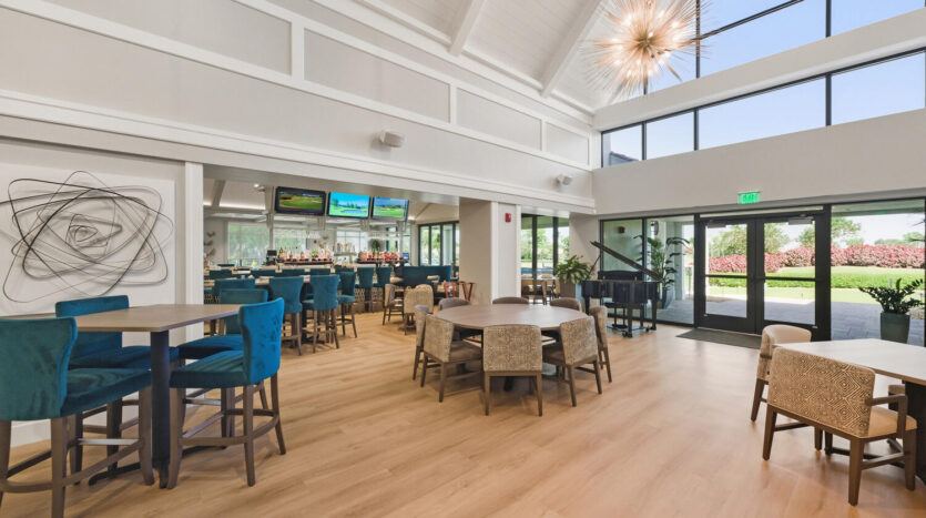 Modern restaurant interior with natural light and stylish seating.